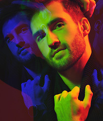 Image showing Double exposure, cyberpunk and portrait of a man in color isolated on a dark background in studio. Futuristic, art and model in creative, neon and aesthetic lighting with overlay on a black backdrop