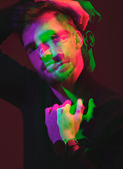 Image showing Double exposure, futuristic and portrait of a man in color isolated on a dark background in studio. 3d, art and model in creative, neon and aesthetic lighting with overlay on a black backdrop