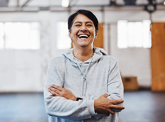 Image showing Arms crossed, laughing and portrait of a woman in the gym for fitness, training and exercise. Motivation, happy and funny mature athlete with cardio vision, workout smile and confidence in sports