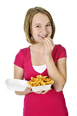 Image showing Teenage girl with french fries