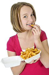 Image showing Teenage girl with french fries