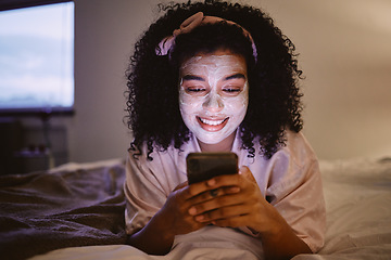 Image showing Black woman, afro or skincare mask and phone in house bedroom, home or hotel on social media app or web. Smile, happy or facial product on relax person on mobile technology for face grooming research