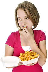 Image showing Teenage girl with french fries