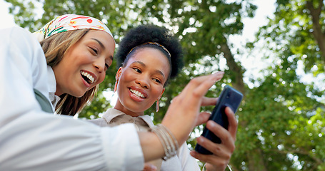 Image showing Friends with phone, funny meme on social media and relax outdoor during coffee break, communication and technology. Women together in city, comedy with 5g network and laughing at content online