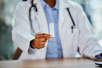 Image showing Covid 19, antigen test and doctor hand for healthcare, compliance or insurance in hospital office bokeh. Pharmacy, clinic and professional black woman or medical expert product for corona virus exam