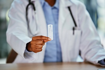 Image showing Covid, antigen test and doctor hand for healthcare, compliance or insurance in hospital office bokeh. Pharmacy, clinic and professional black woman or medical expert product for corona virus exam