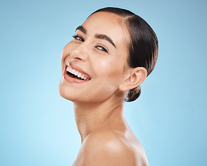 Image showing Portrait, skincare and woman with smile, cosmetics and dermatology against blue studio background. Face detox, female and lady with happiness, wellness and morning routine for grooming and treatment
