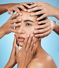 Image showing Touching, hands and face of a woman for skincare isolated on a blue background in a studio. Consultation, check and girl with people feeling for facial acne, problem and dermatology on a backdrop