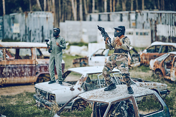 Image showing Paintball, winner and soldier with gun and fist pump, victory on battlefield with military man, fitness and winning game. Sport, achievement and yes in camouflage, celebration and war win outdoor