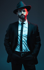 Image showing Man portrait, suit or fashion on studio background in secret spy, dark isolated mafia or crime lord aesthetic. Model, gangster or serious bodyguard in stylish, trendy or tuxedo clothes in leadership