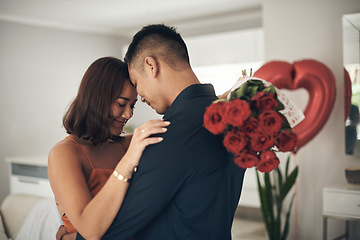 Image showing Love, roses and valentines day with a couple hugging in their home, in celebration of romance. Dating, flowering boquet or surprise with a man and woman in a house to hug while bonding in intimacy