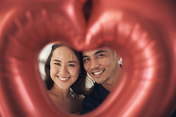 Image showing Valentines day heart, balloon and young couple portrait celebrate love, happiness and care. Red balloons, present and romance of a happy Asian woman and man from Peru together with a smile on a date