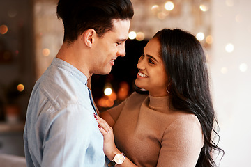 Image showing Love, romance and happy couple hugging on a date for valentines day, romantic event or anniversary. Happiness, smile and interracial man and woman embracing after a dinner celebration together.