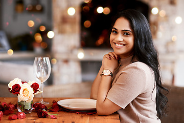 Image showing Indian woman, restaurant smile and portrait of young person ready for a romantic date. Bokeh lights, fine dining and female with a glass and happiness for anniversary or valentines day feeling relax