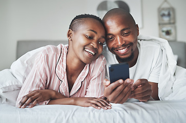 Image showing Phone, contact and morning with a black couple in bed together to relax in the bedroom of their home. Mobile, meme or social media with a man and woman browsing the internet while relaxing or bonding