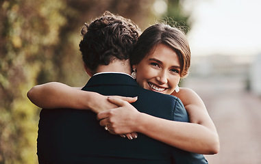 Image showing Couple hug outdoor, love marriage and commitment, wedding day with partnership and respect. Life partner, happiness and groom with bride smile and loyalty with happy people, trust and support