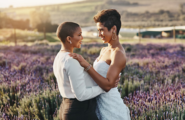 Image showing Woman, lesbian couple and hug with smile for wedding, marriage or commitment in pride and support for LGBT in nature. Happy gay married women hugging, smiling and enjoying celebration in love outside