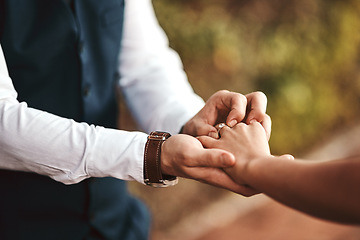 Image showing Closeup, love and man with woman, ring for celebration and romance for relationship, outdoor or achievement. Zoom, couple or wedding band for bonding, loving together or romantic gesture for marriage