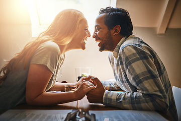 Image showing Love, couple and holding hands on table at restaurant, laughing at funny joke and bonding. Valentines day, romance diversity and affection, passion or care of man and woman enjoying date time at cafe