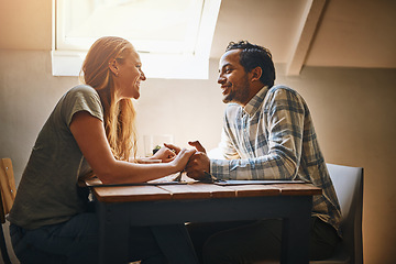 Image showing Couple, love and holding hands at restaurant table, talking and bonding together. Valentines day, romance diversity and affection of man and woman on date, having fun or enjoying quality time at cafe