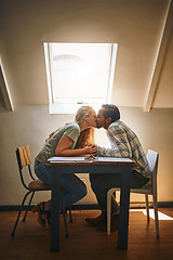 Image showing Holding hands, love kiss and couple at restaurant, having fun or bonding at table. Valentines day, romance diversity or affection, kissing or care of man and woman enjoying romantic date time at cafe