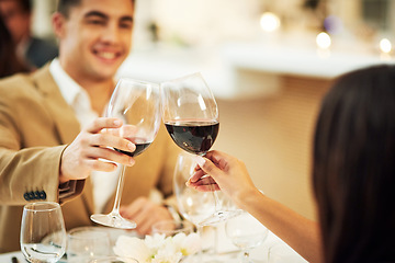 Image showing Toast, wine and couple in restaurant for celebration, romantic dinner and anniversary together. Relationship, fine dining and man and woman cheers with drinks, alcohol and relax at hotel on honeymoon