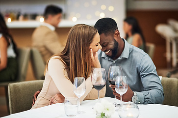 Image showing Funny, date and interracial couple with red wine for fine dining, luxury restaurant or valentines celebration together. Black man, happy woman and alcohol glasses for romance, wealth or anniversary