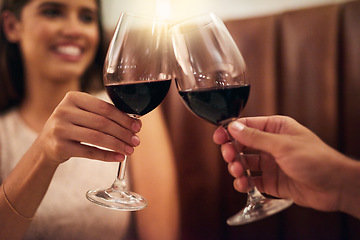 Image showing Hand, wine glasses and couple in restaurant for achievement, celebration or romance on Valentines day. Romantic, man or happy woman with zoom, cheers or alcohol for date, affection or toast with love