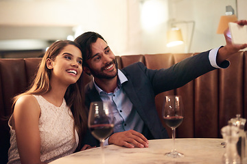 Image showing Selfie, wine and anniversary with a couple in a restaurant for a romantic fine dining celebration of love. Photograph, alcohol or valentines day with a man and woman celebrating a milestone together