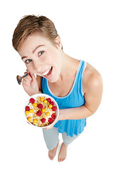 Image showing Portrait, breakfast and food with a woman in studio isolated on a white background for health from above. Diet, muesli and overhead with an attractive young female eating healthy for nutrition