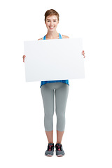 Image showing Announcement, news and portrait of a woman with a board isolated on a white background in studio. Billboard, branding and girl holding a blank mockup banner with space for advertising on a backdrop