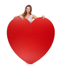 Image showing Love, heart and woman on valentines day with a big gift, object or romantic product isolated in studio white background. Portrait, emoji and icon by female happy, smile and symbol for care