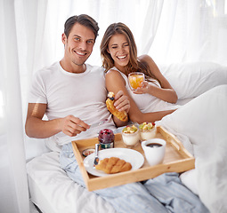 Image showing Breakfast, morning and couple laughing portrait with love, care and food together in home bed. Happiness, smile and relax young people eating and drinking in a house for anniversary or valentines day