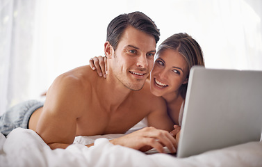 Image showing Couple with laptop, streaming movie and relax at home with technology, happy and fun together with film website Love, commitment and relationship with man and woman in bedroom with subscription