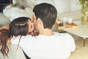 Image showing Love, kiss and couple relax on living room sofa for home Valentines Day, bonding and quality time together. Marriage, vacation and back of romantic people in holiday house in Rio de Janeiro Brazil