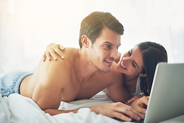 Image showing Couple with laptop, streaming and relax in home with technology, wifi and happy to chill together. Love, commitment and relationship with man and woman in bedroom with film website subscription