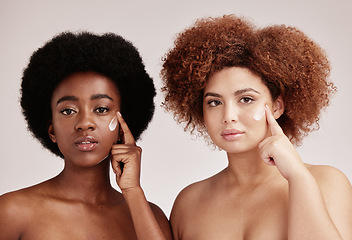 Image showing Women, skincare cream and portrait of girl friends using sunscreen, lotion product and dermatology. Wellness, self care beauty and spa aesthetic doing a facial for dermatology in isolated studio