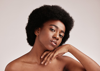 Image showing Portrait, beauty or skincare and a model black woman in studio on a gray background with afro hair. Skin, cosmetics and natural with an attractive young female posing indoor for health or wellness