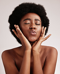 Image showing black woman, kiss and model face with skincare, beauty and spa aesthetic in a studio. Isolated, white background and wellness treatment of a young person feeling calm from self care and dermatology