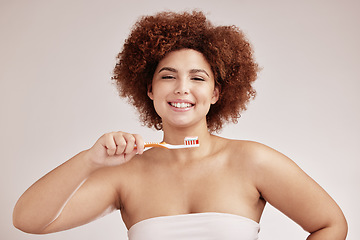 Image showing Black woman, studio portrait and toothbrush for cleaning, healthy mouth and hygiene by background. Happy gen z model, brushing teeth and smile for beauty, wellness or self care with dental toothpaste