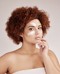 Image showing Facial cream, skincare and portrait of a woman with beauty, dermatology and face lotion. Sunscreen, wellness and detox moisturizer in a isolated studio with a model with skin glow and self care