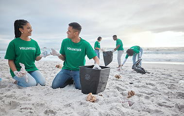 Image showing Friends, help and recycling with people on beach for sustainability, environment and eco friendly. Climate change, earth day and nature with volunteer and plastic for cleaning, energy and pollution