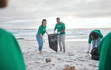 Image showing Teamwork, charity and recycling with people on beach for sustainability, environment and eco friendly. Climate change, earth day and nature with volunteer and plastic for help, energy and pollution