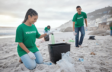 Image showing Teamwork, cleaning and recycling with people on beach for sustainability, environment and eco friendly. Climate change, earth day and nature with volunteer and plastic for help, energy and pollution