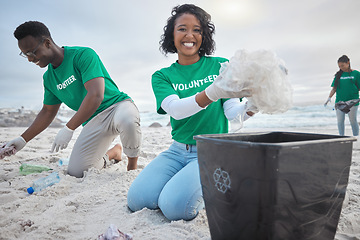 Image showing Teamwork, cleaning and volunteer with people on beach for sustainability, environment and eco friendly. Climate change, earth day and nature with friends and plastic for help, energy and pollution