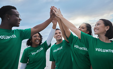 Image showing Teamwork, high five and volunteer with people on beach for sustainability, environment and climate change. Charity, earth day and community with friends for support, diversity and pollution awareness