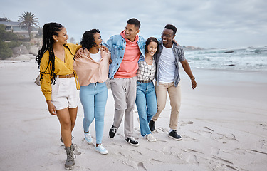 Image showing Diversity, happy and friends walking at the beach for holiday, vacation and bonding on nature background. Men, smile and women group relax at the sea, laugh and cheerful on an ocean trip in Miami