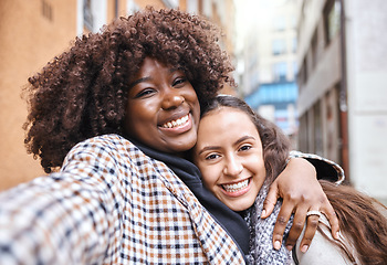 Image showing Friendship, happy and portrait of women on a holiday together walking in the city street in Italy. Happiness, smile and interracial female gay couple hugging in the road in town while on a vacation.