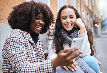 Image showing Friends, city and women with phone for social media, conversation and connection on London street. Communication, internet and happy black woman and girl on smartphone smile for selfie, app and meme