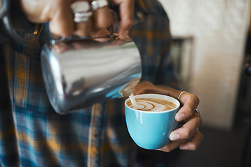 Image showing Latte art, coffee and barista hands with process, workflow and production with drink and working in cafe. Creative, man drawing with milk foam and hospitality with service and beverage closeup